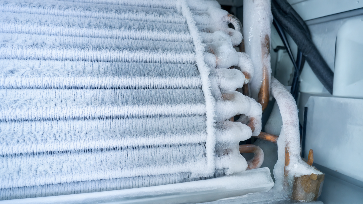 Ice and frost buildup on a frozen evaporator coil from low refrigerant